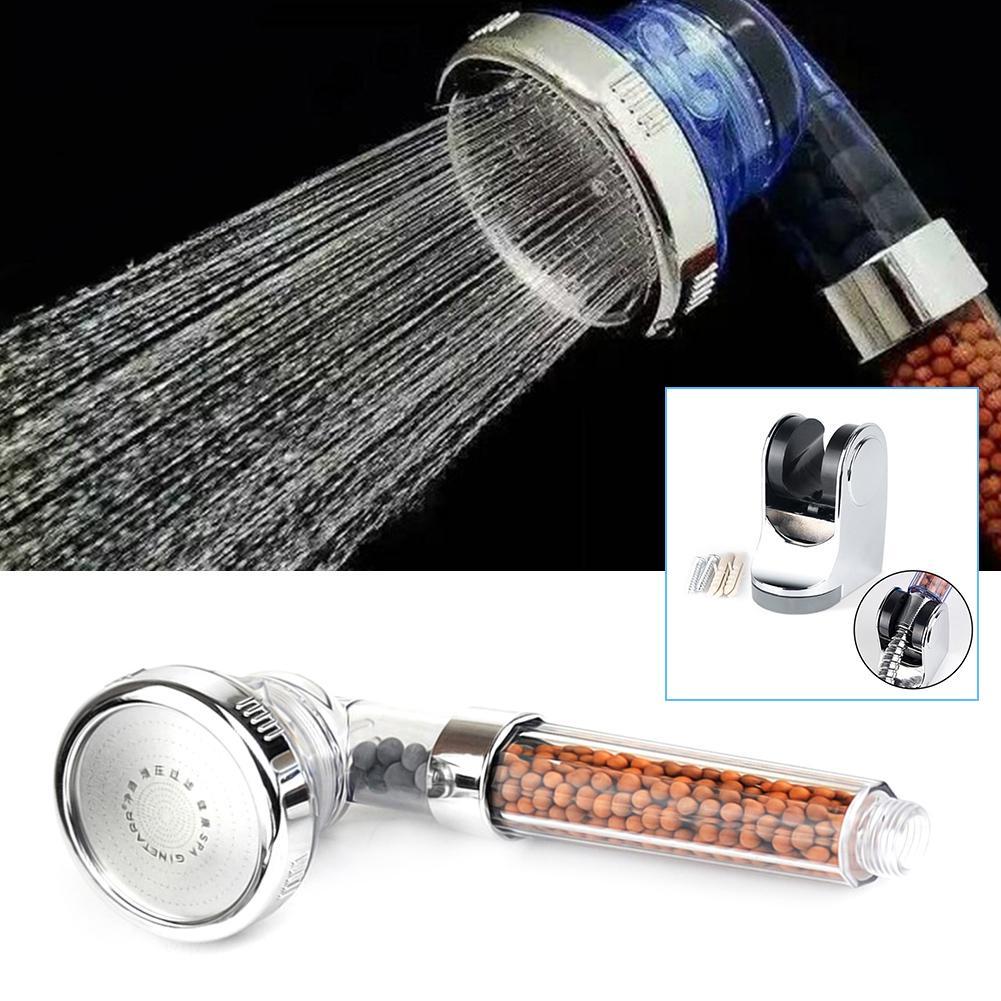 3 mode shower head with built in water purifier filter with blue and clear plastic housing, showing close up and additional angles on a black background.