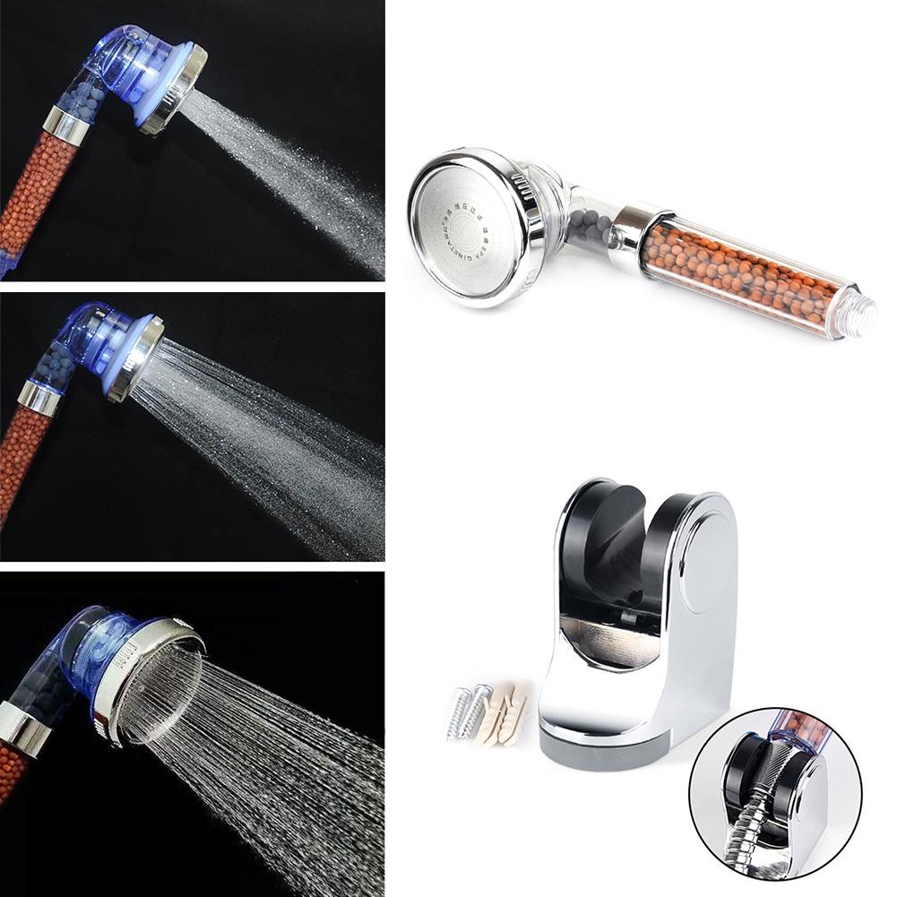 3 mode shower head with built in water purifier filter with multiple nozzles and water flow on a white background