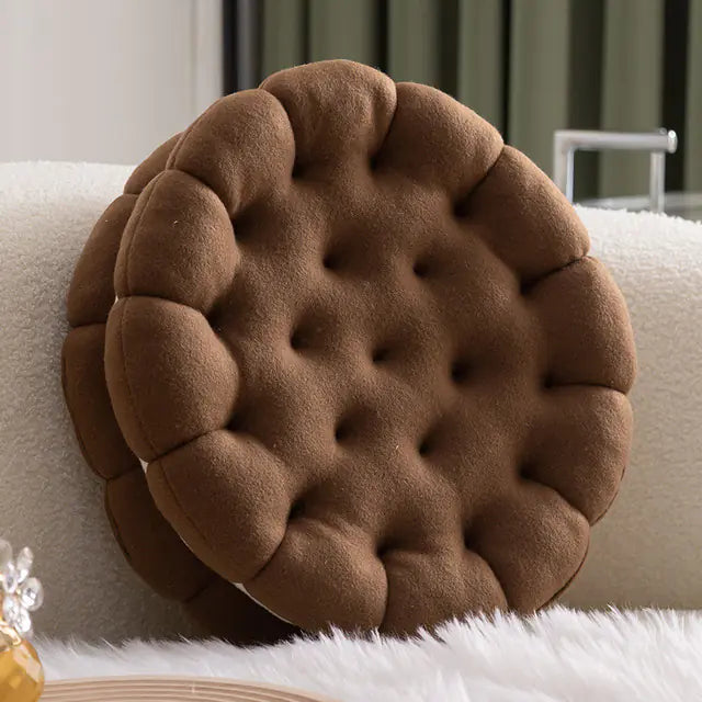 Cute biscuit shaped plush cushion in chocolate coffee, soft cartoon cookie pillow for home decor on a beige sofa