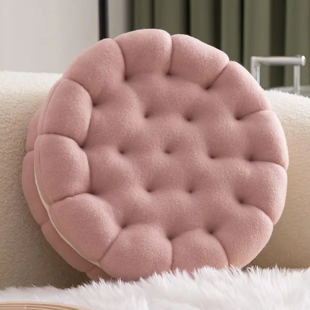 Cute biscuit shaped plush cushion strawberry pink with details on a soft surface