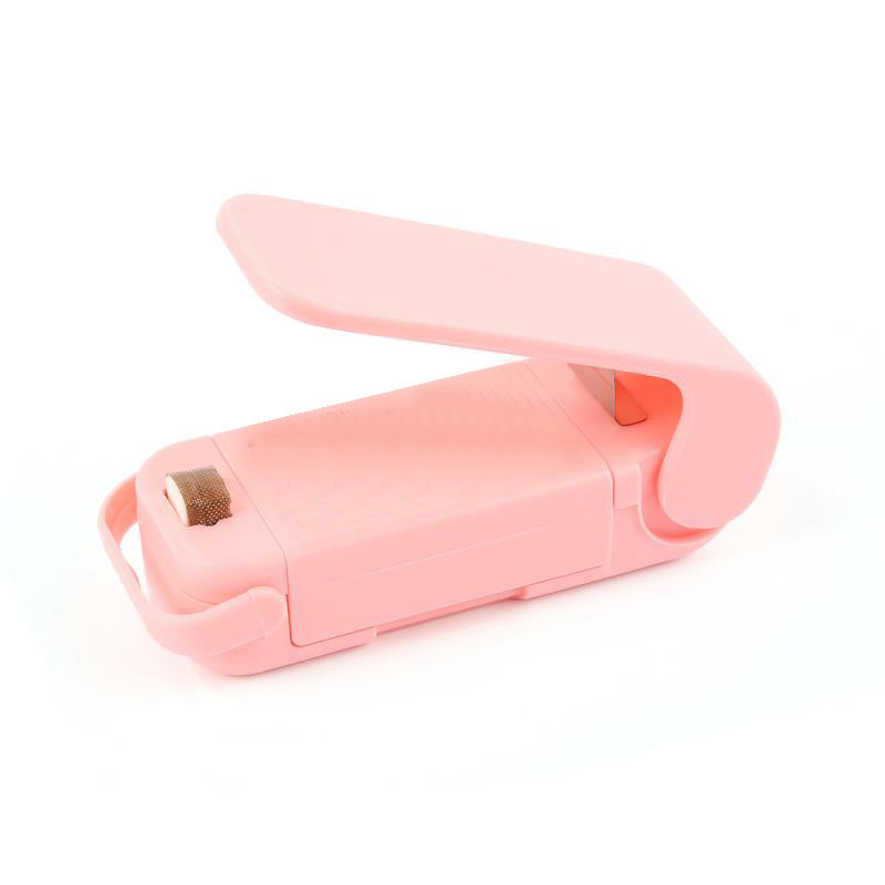 Pink Mini heat bag sealer device on a white background