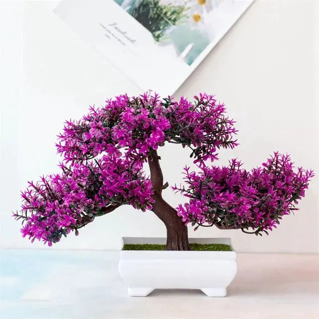 Artificial bonsai tree with purple foliage on a light background