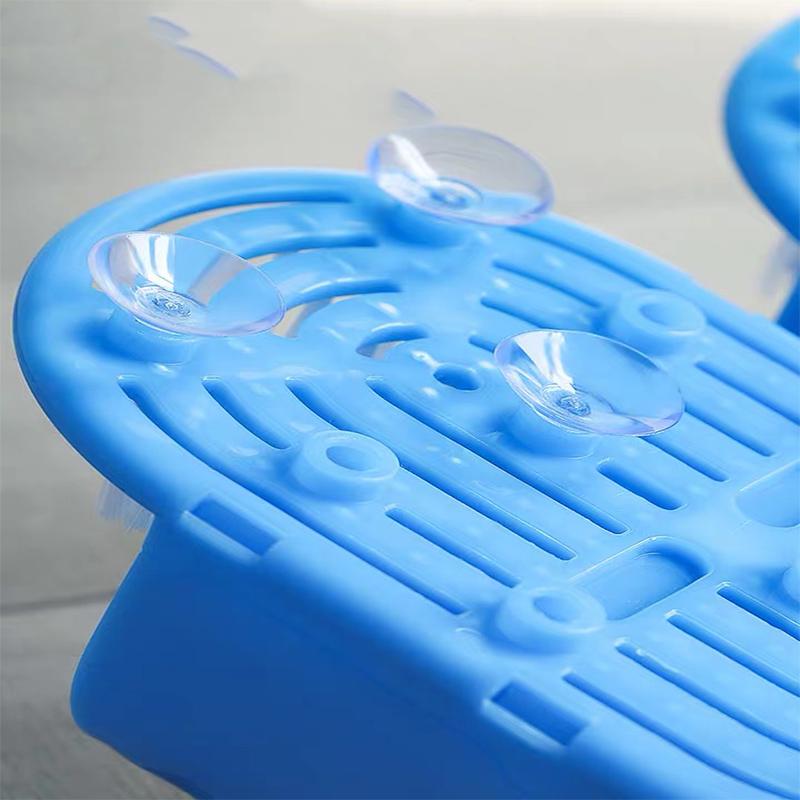 Blue plastic foot scrubber with suction cups on a grey background