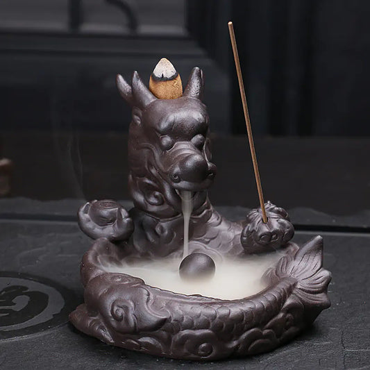 Dragon backflow incense burner made of purple sand with dragon and pearl design, creating mesmerizing smoke waterfall effect for home decor and aromatherapy with incense sticks on a dark background