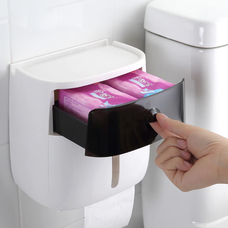 Handy wall mounted waterproof toilet paper holder with storage drawer with toilet paper and hand reaching for it.