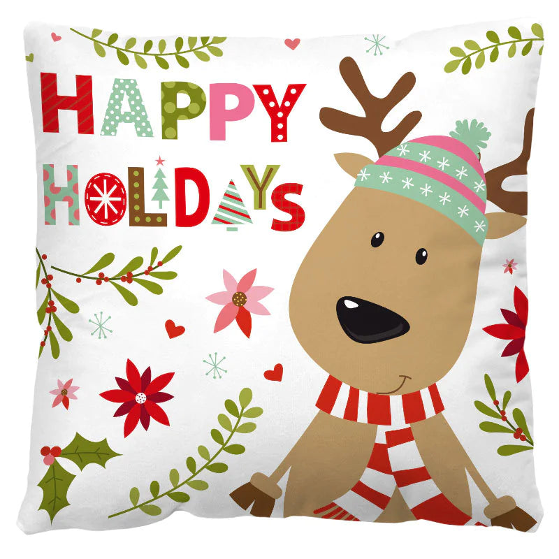 Decorative pillow with a reindeer wearing a hat and scarf, surrounded by festive patterns and 'Happy Holidays' text.