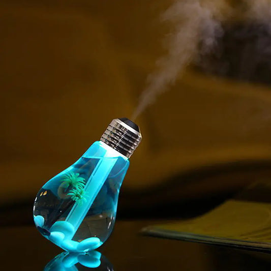 LED humidifier lamp with bulb design in silver finish displaying colourful ambient lighting on modern home decor table