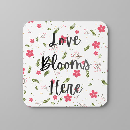 Love Blooms Here floral quote coaster with premium cork backing and waterproof glossy finish for coffee table protection and home decor - Black/Red/Green - Grey Background