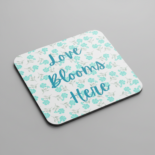 Love Blooms Here floral quote coaster with premium cork backing and waterproof glossy finish for coffee table protection and home decor - Green - Grey Background