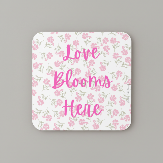 Love Blooms Here floral quote coaster with premium cork backing and waterproof glossy finish for coffee table protection and home decor - Pink - Grey Background