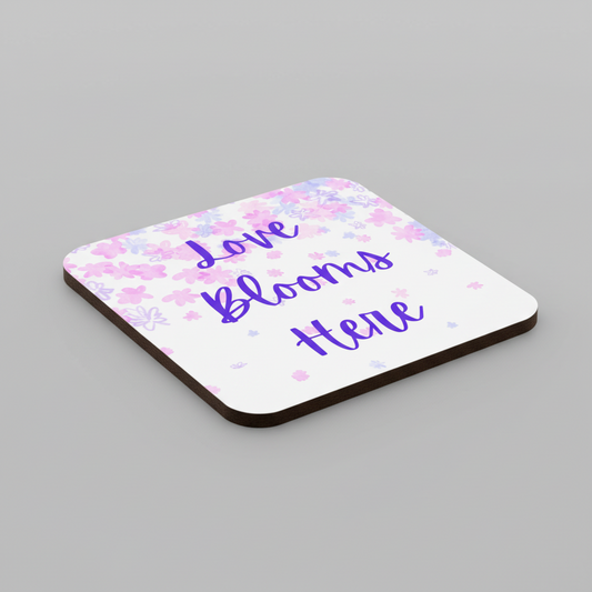 Love Blooms Here floral quote coaster with premium cork backing and waterproof glossy finish for coffee table protection and home decor - Pink/Purple - Grey Background