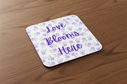 Love Blooms Here floral quote coaster with premium cork backing and waterproof glossy finish for coffee table protection and home decor - Purple - Wood Table