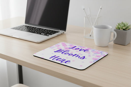 Love Blooms Here inspirational mouse pad with non slip rubber base and smooth polyester surface for gaming, home office, and computer desk workspace decor. Pink and Purple - Wood Desk