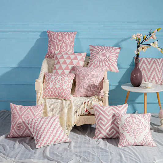 Luxury Pink and white embroidered cotton cushion covers with modern design.