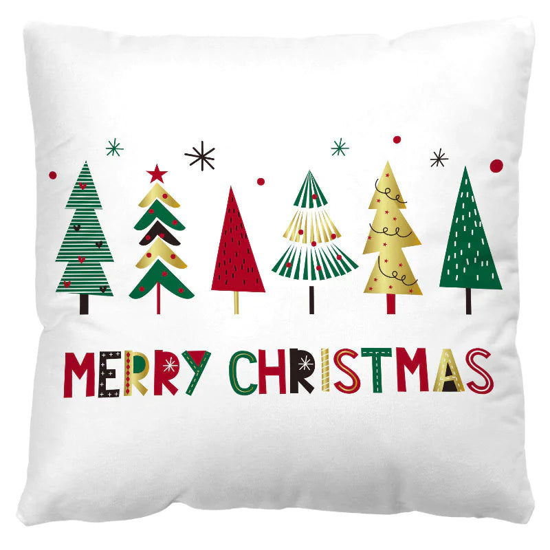 Decorative pillow with Christmas tree designs and 'Merry Christmas' text on a white background