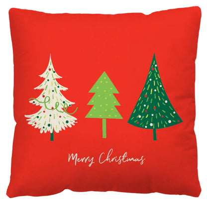 Red pillow with Christmas tree designs and 'Merry Christmas' text on a white background