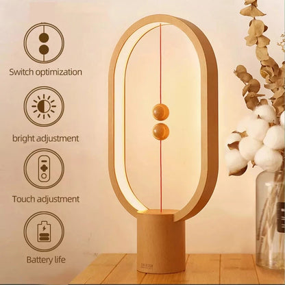 Modern LED magnetic table lamp with suspended magnetic sphere switch creating ambient warm lighting with features highlighted on a beige background
