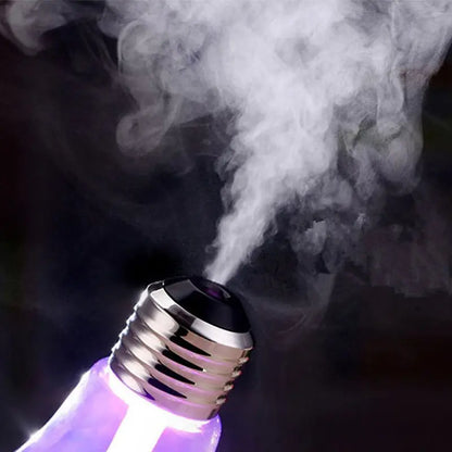 Purple light bulb emitting smoke against a dark background