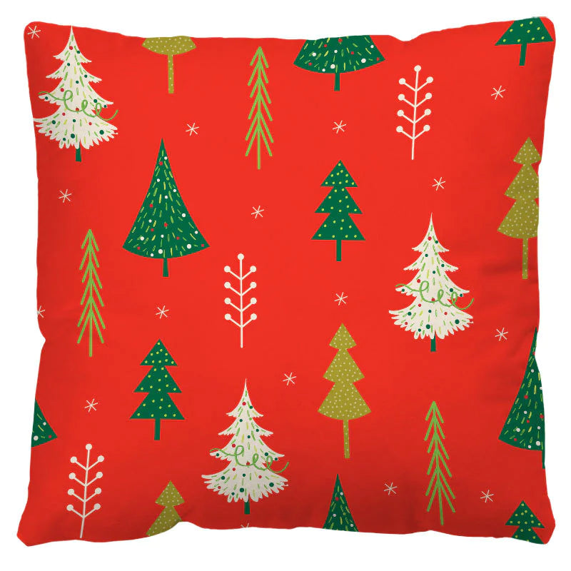 Red pillow with green and white Christmas tree pattern