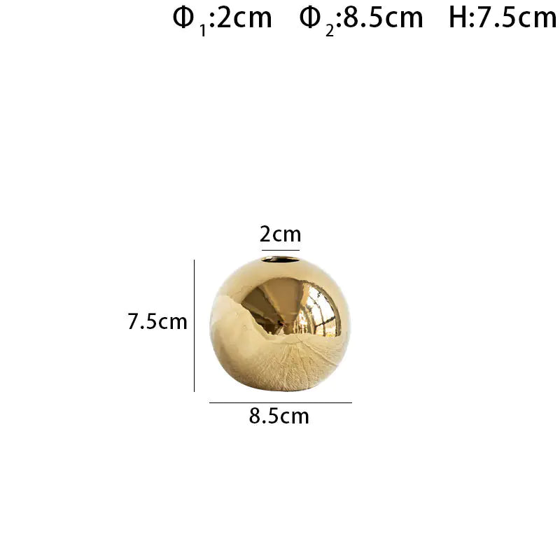Small luxury gold electroplated spherical vase with dimensions labelled on a white background
