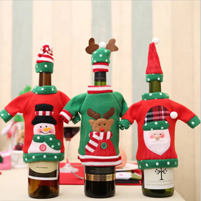 Three wine bottles with festive Christmas themed bottle covers on a neutral background.