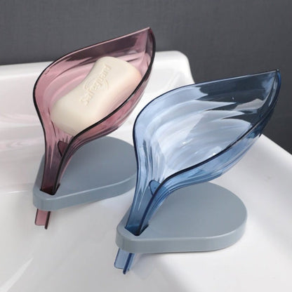 Two leaf soap drain holders attached to bathroom sink