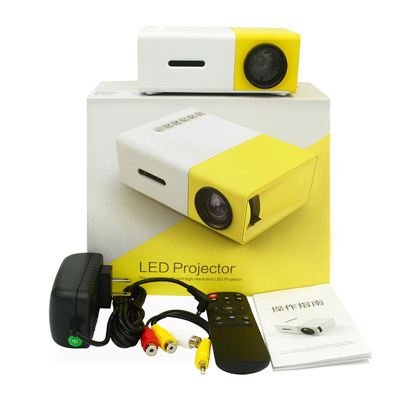 Yellow and white LED projector with accessories on a white background